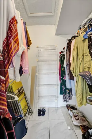 a bedroom with a bed and a desk