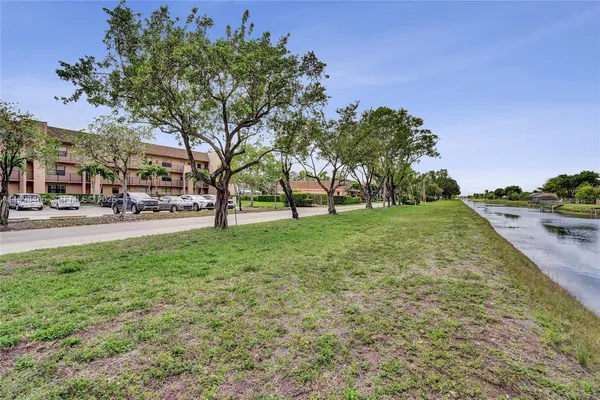 a view of a lake with houses in the back