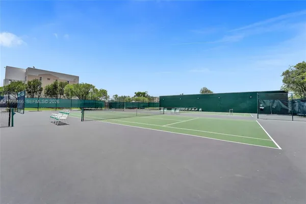 a view of swimming pool with outdoor seating and city view