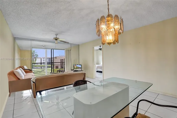 a very nice looking dining room with a table and chairs