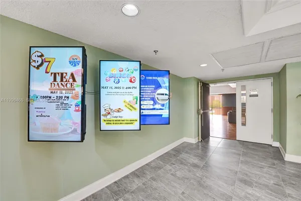 a living room with lots of furniture and kitchen view