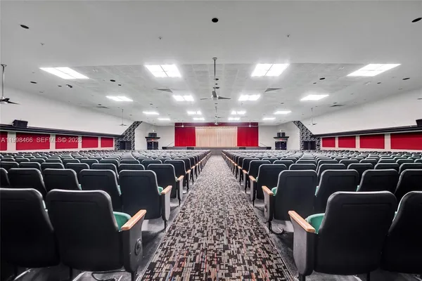 a living room with furniture a dining table and chairs