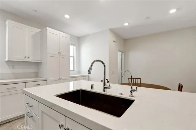 a kitchen with a sink and a stove