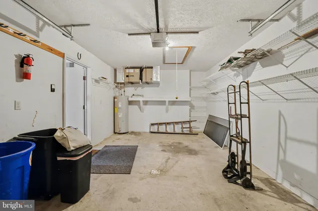 a living room with lots of furniture and white walls