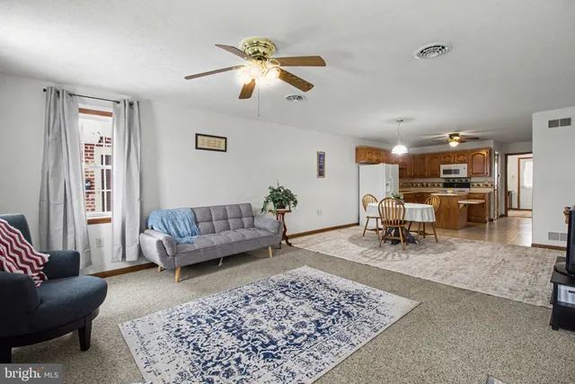 a living room with furniture and a rug