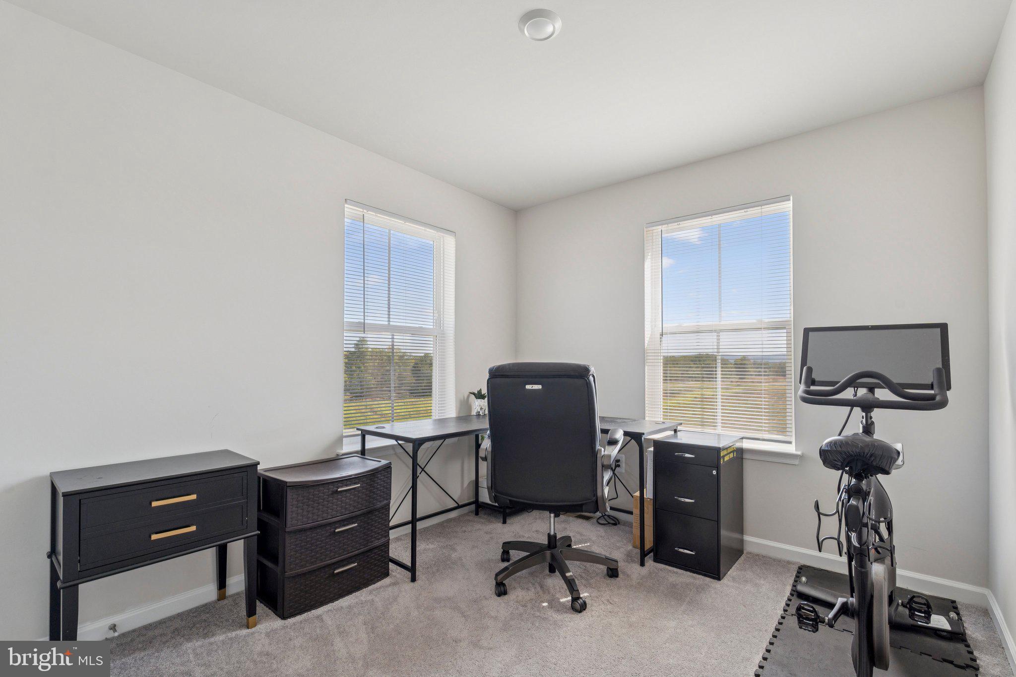 79 Swan Fld Avenue Ranson, WV 25438 - Photo 15 of 22 a view of a workspace with furniture and a window