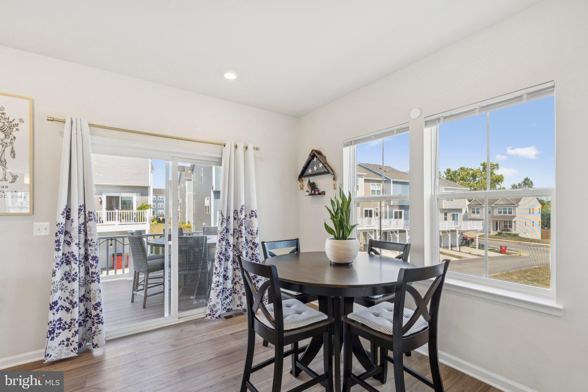 79 Swan Fld Avenue Ranson, WV 25438 - Photo 6 of 22 a view of a dining room with furniture window and wooden floor