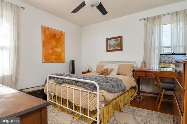 a bedroom with a bed and a table in it