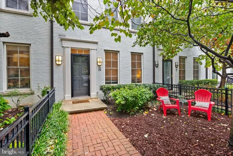a front view of house with outdoor space and garden