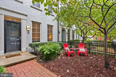 a view of a hallway with dining area
