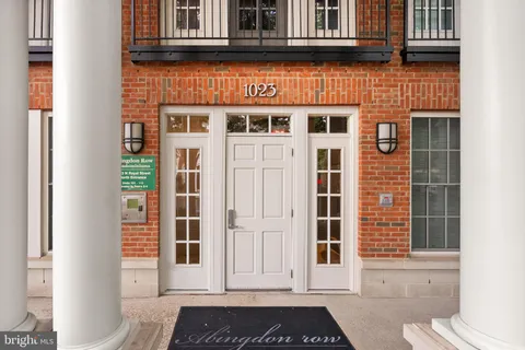 a picture of a bench in front of a wall