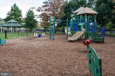 a view of a park with swings and slides