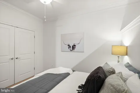 a bedroom with a bed and a lamp
