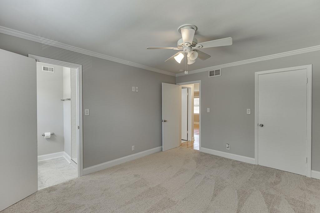 4282 Roswell Road Northeast, Unit D2 Atlanta, GA 30342 - Photo 25 of 42 a view of an empty room and a ceiling fan window