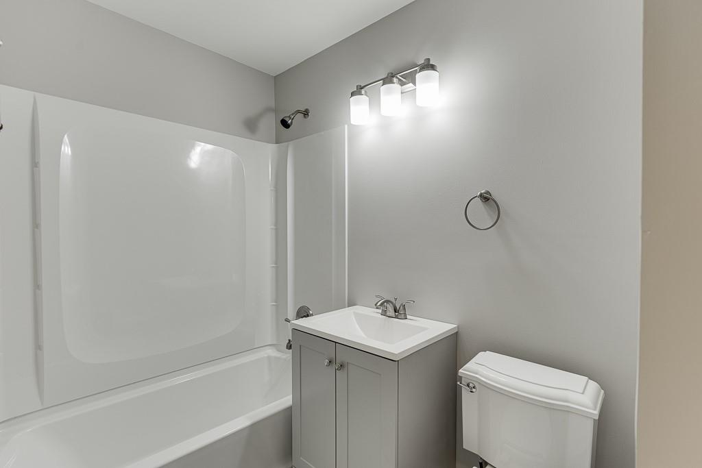 4282 Roswell Road Northeast, Unit D2 Atlanta, GA 30342 - Photo 31 of 42 a bathroom with a sink toilet and shower