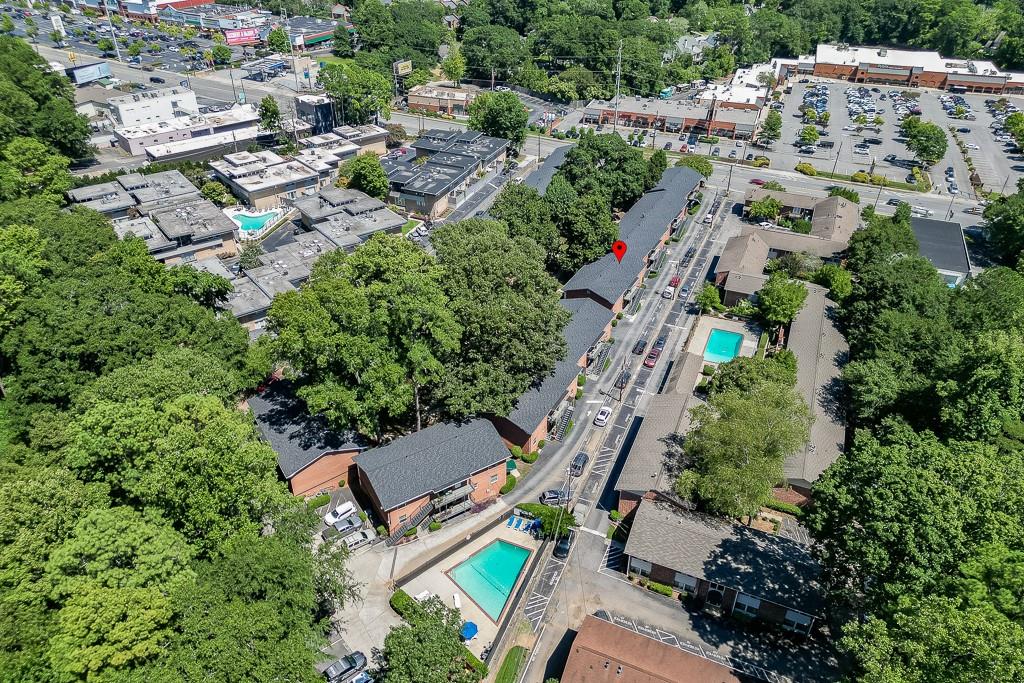 4282 Roswell Road Northeast, Unit D2 Atlanta, GA 30342 - Photo 40 of 42 an aerial view of a house with a yard and outdoor seating