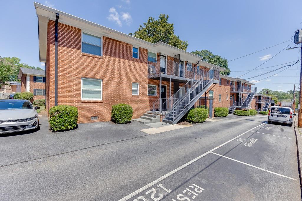 4282 Roswell Road Northeast, Unit D2 Atlanta, GA 30342 - Photo 4 of 42 a car parked in front of house