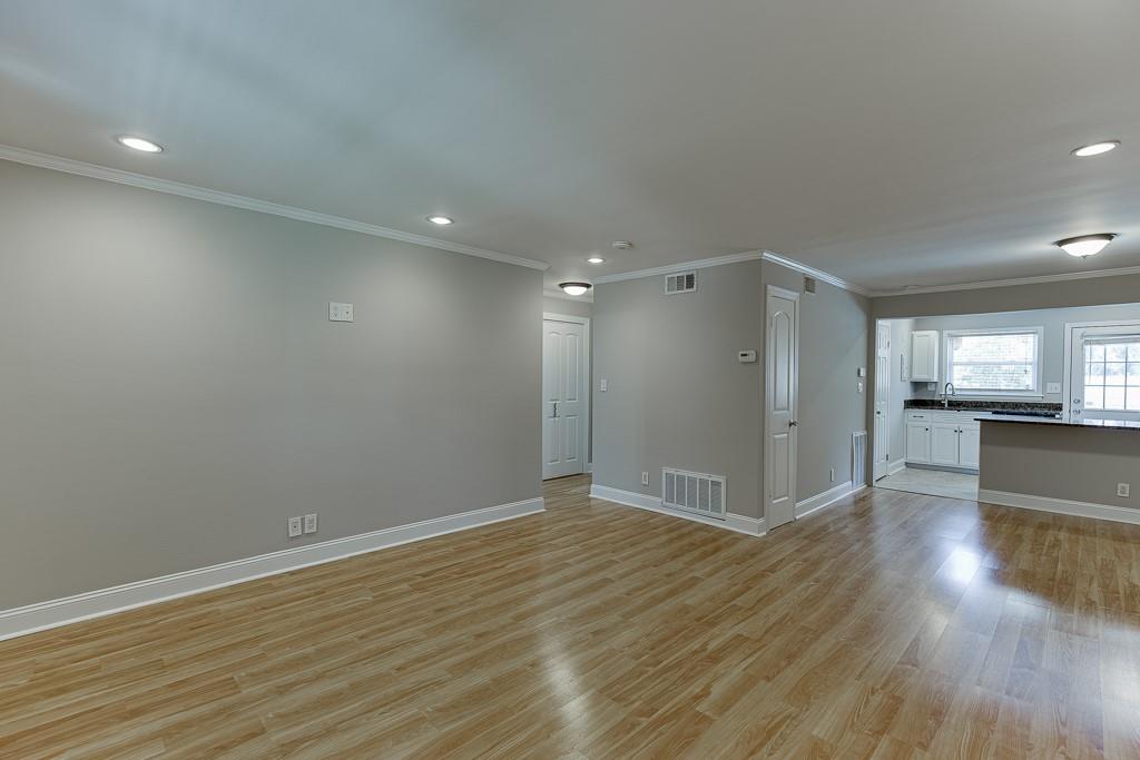 4282 Roswell Road Northeast, Unit D2 Atlanta, GA 30342 - Photo 9 of 42 a view of empty room with wooden floor