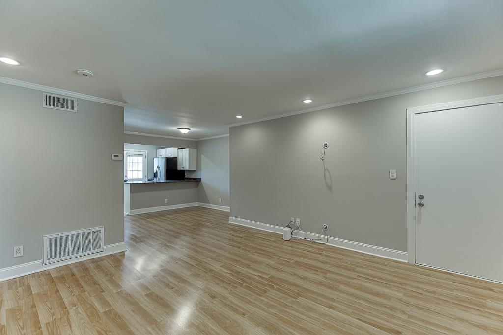 4282 Roswell Road Northeast, Unit D2 Atlanta, GA 30342 - Photo 10 of 42 a view of empty room with wooden floor