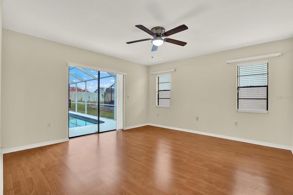 1503 Overland Drive Spring Hill, FL 34608 - Photo 11 of 24 wooden floor in an empty room with a window