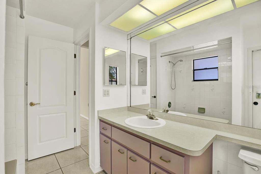 1503 Overland Drive Spring Hill, FL 34608 - Photo 15 of 24 a bathroom with a sink vanity and a mirror