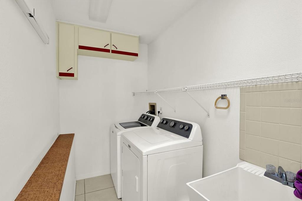 1503 Overland Drive Spring Hill, FL 34608 - Photo 17 of 24 a utility room with dryer and washer