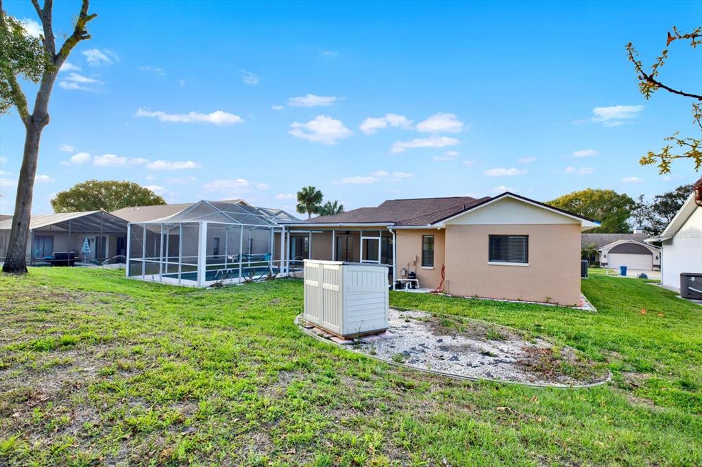 1503 Overland Drive Spring Hill, FL 34608 - Photo 18 of 24 a front view of a house with garden