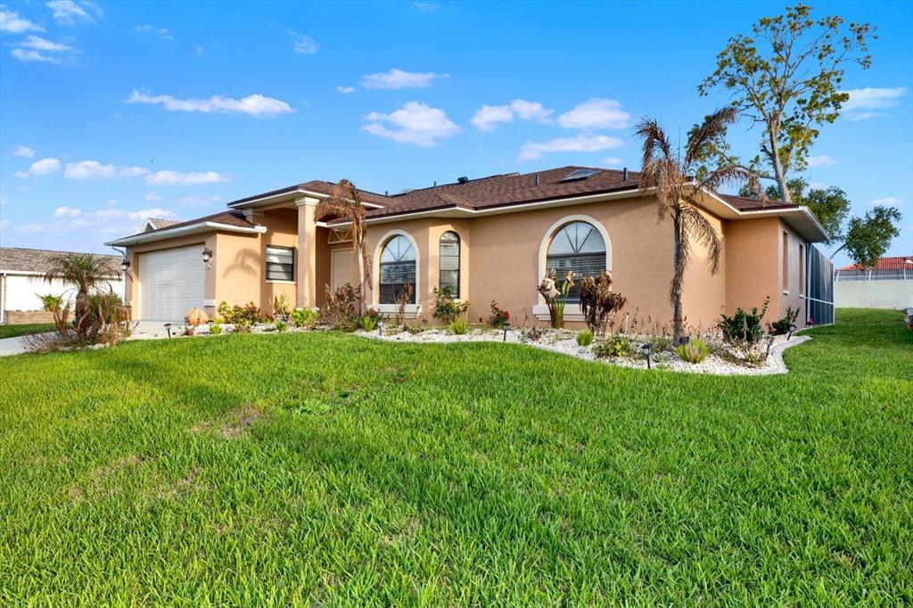 1503 Overland Drive Spring Hill, FL 34608 - Photo 19 of 24 a front view of a house with garden