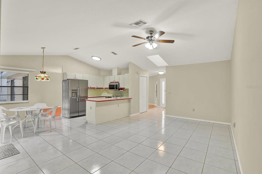 1503 Overland Drive Spring Hill, FL 34608 - Photo 10 of 24 a view of kitchen with granite countertop cabinets and refrigerator