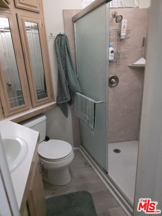 84136 Ave 44, Unit 660 Indio, CA 92203 - Photo 13 of 16 a bathroom with a toilet and a sink