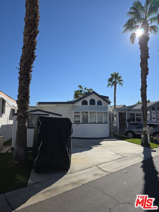 84136 Ave 44, Unit 660 Indio, CA 92203 - Photo 2 of 16 a view of a house with a yard