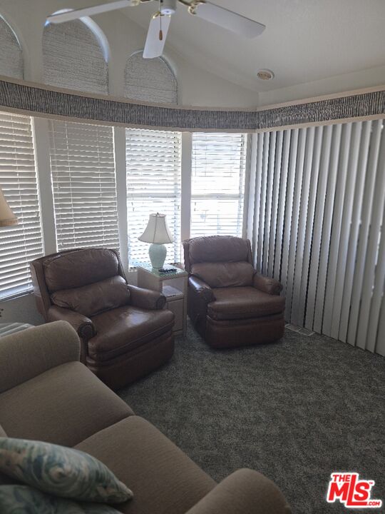 84136 Ave 44, Unit 660 Indio, CA 92203 - Photo 7 of 16 a living room with furniture and a large window