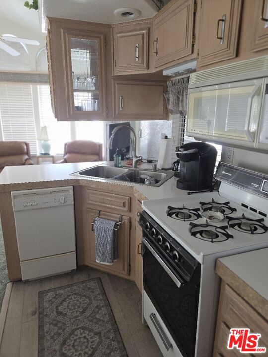 84136 Ave 44, Unit 660 Indio, CA 92203 - Photo 10 of 16 a kitchen with a stove and a sink