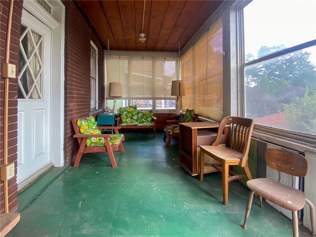 433 Pinney Street Rochester, PA 15074 - Photo 3 of 11 a balcony with chairs and a table