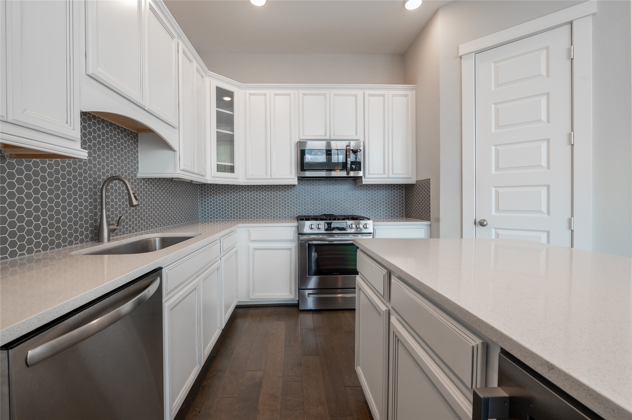 963 Lilly Flower Lane Houston, TX 77091 - Photo 15 of 28 Kitchen with stainless steel appliances and a large island