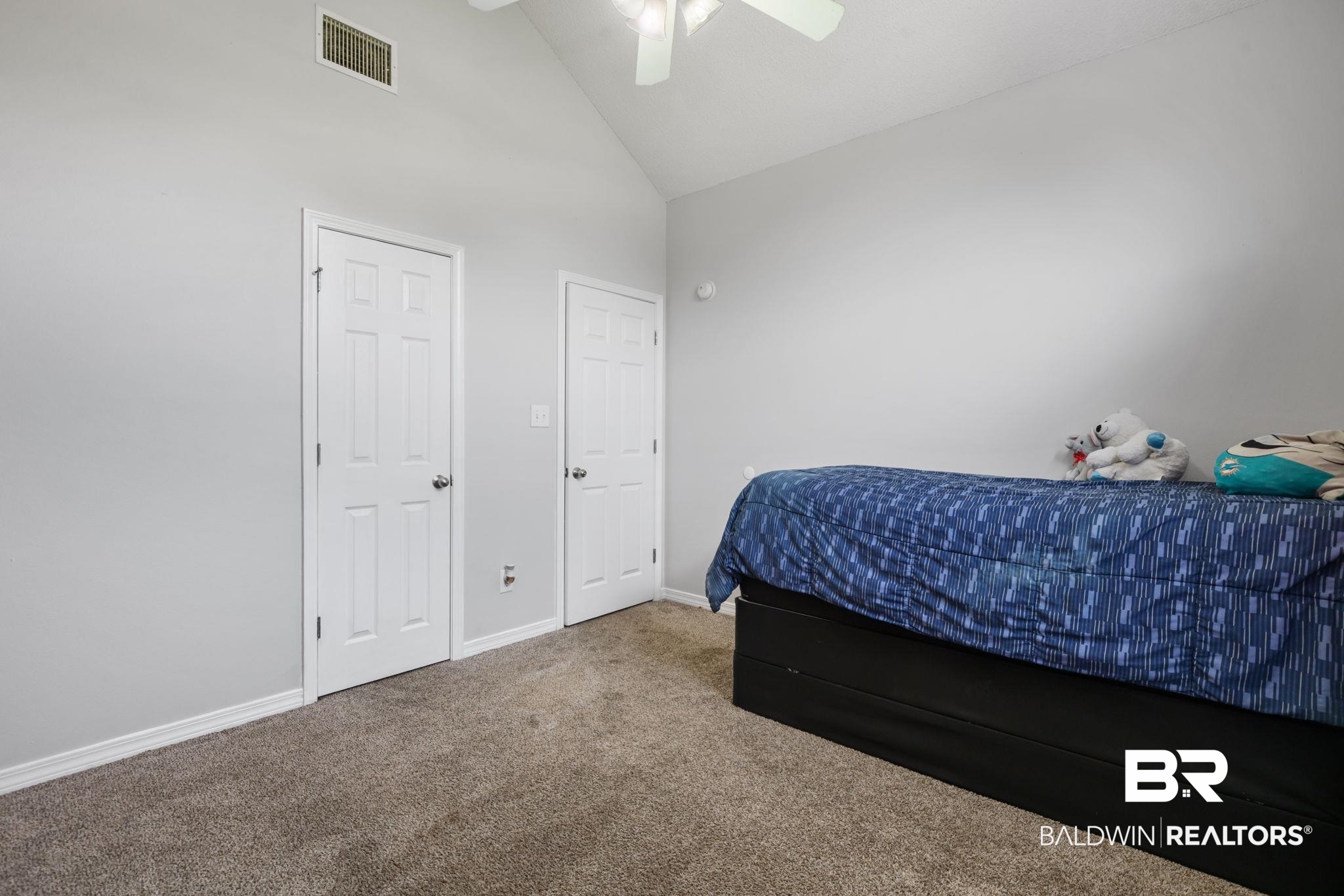 9422 Labrador Run South Mobile, AL 36695 - Photo 30 of 36 Carpeted room featuring a vaulted ceiling with a ceiling fan