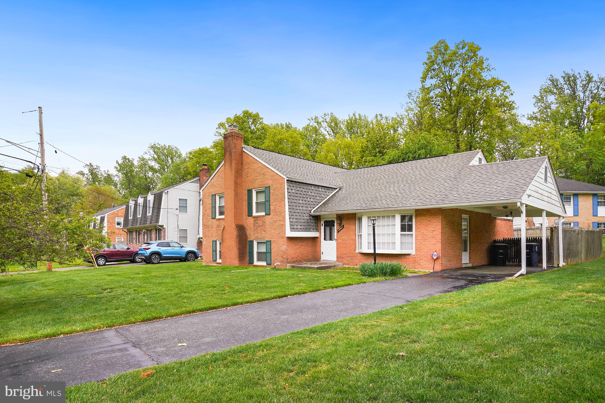 16011 Jerald Road Laurel, MD 20707 - Photo 3 of 5 a front view of house with yard and green space