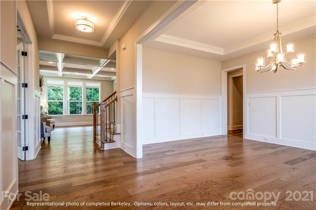 357 Grassy Rdg Court, Unit 50 Clover, SC 29710 - Photo 15 of 27 a view of a livingroom with wooden floor and a ceiling fan