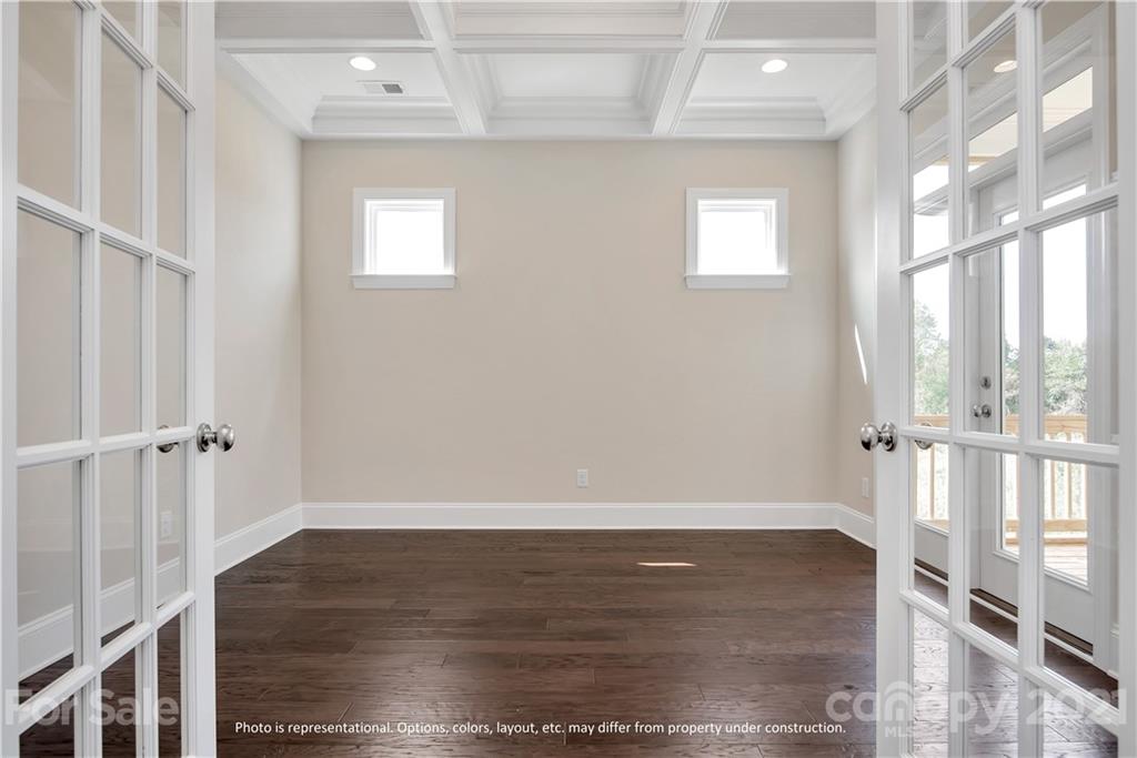 357 Grassy Rdg Court, Unit 50 Clover, SC 29710 - Photo 17 of 27 a view of an empty room with wooden floor and a window