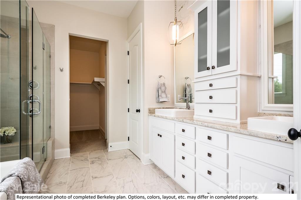 357 Grassy Rdg Court, Unit 50 Clover, SC 29710 - Photo 20 of 27 a bathroom with a sink a mirror and a shower