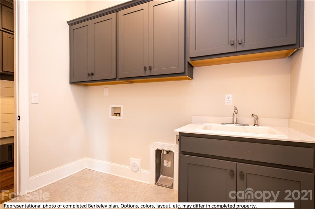 357 Grassy Rdg Court, Unit 50 Clover, SC 29710 - Photo 23 of 27 a bathroom with a sink and a mirror