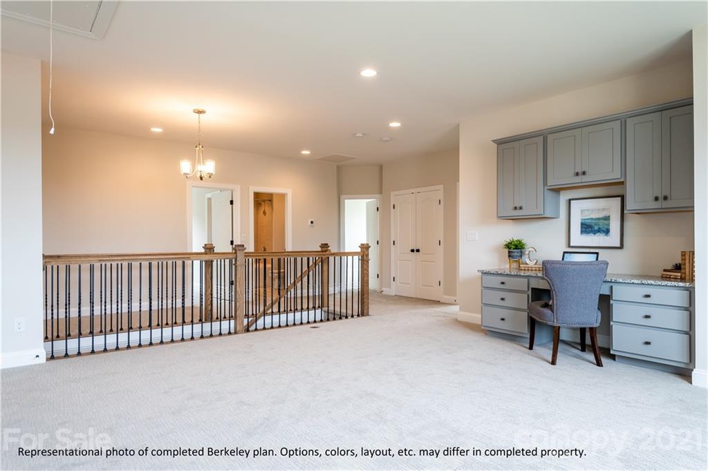 357 Grassy Rdg Court, Unit 50 Clover, SC 29710 - Photo 25 of 27 a view of a big room with windows and cabinet