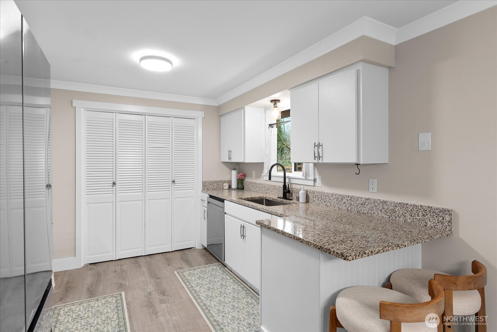 13425 North Echo Lake Road Snohomish, WA 98296 - Photo 13 of 39 a kitchen with a sink cabinets and chair