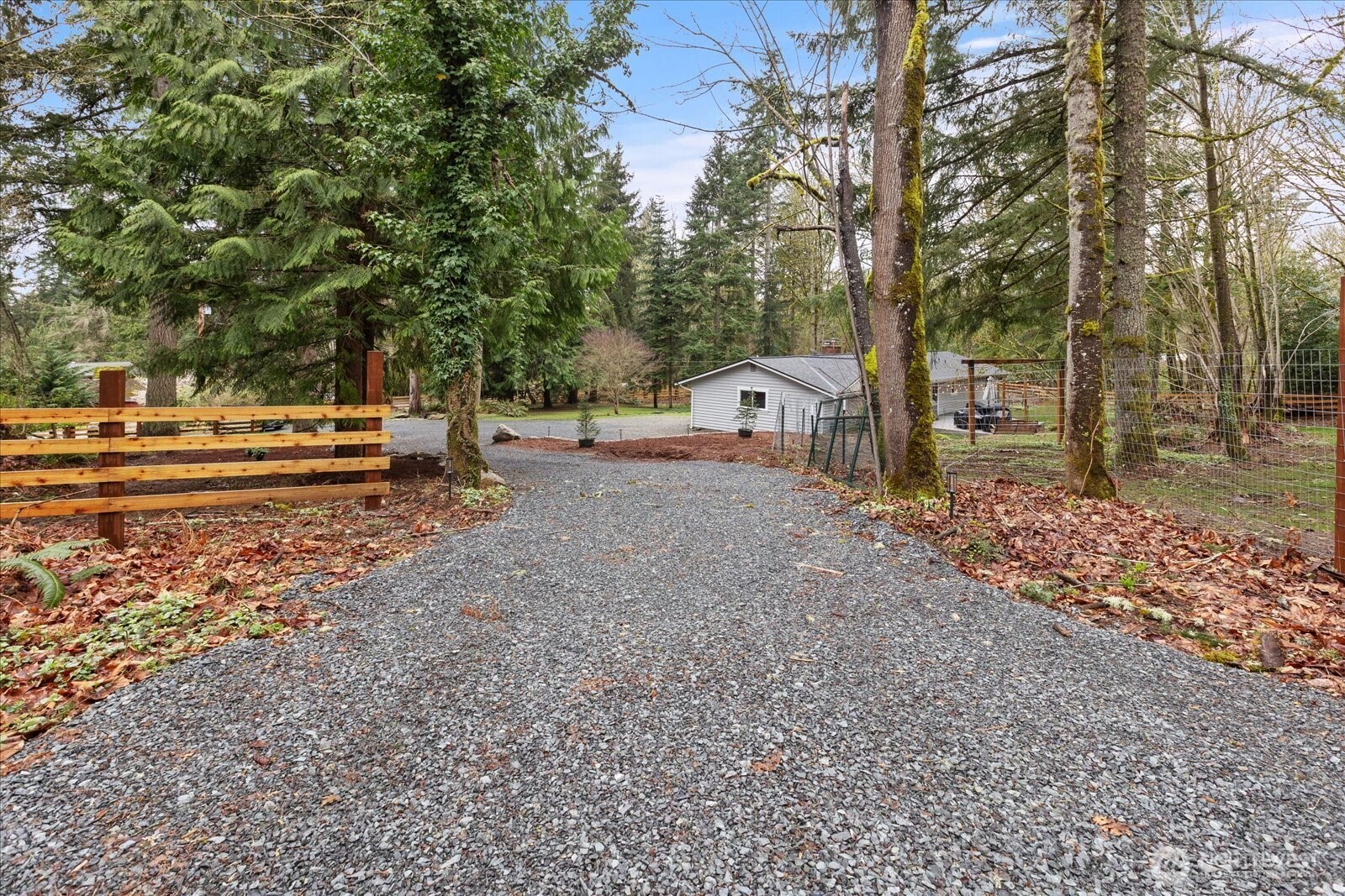 13425 North Echo Lake Road Snohomish, WA 98296 - Photo 35 of 39 a backyard of a house with barbeque oven and wooden fence