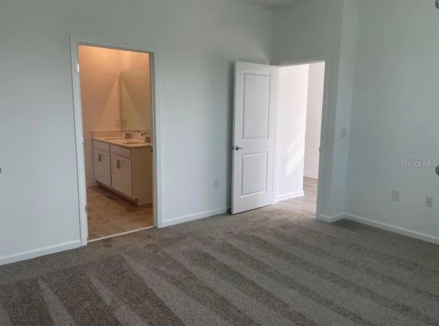 a view of a kitchen from the hallway
