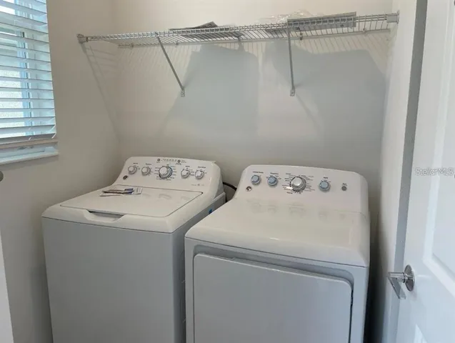 a utility room with dryer and washer