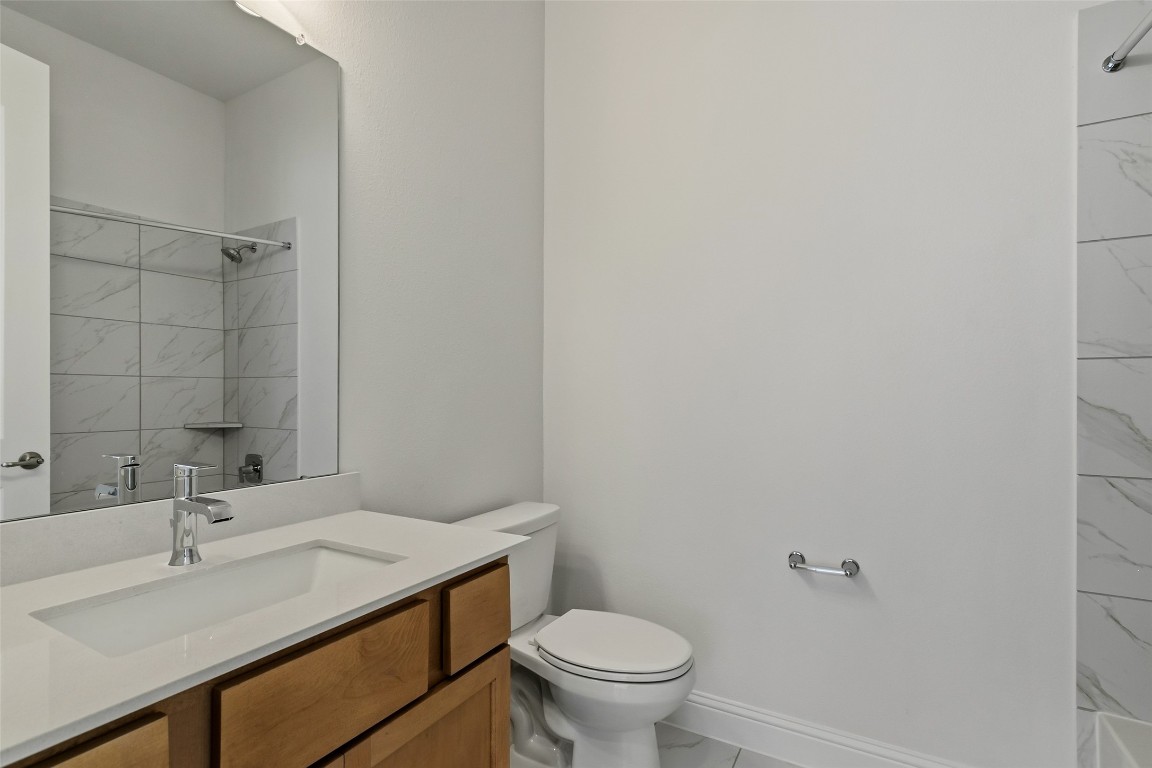 339 Afton June Drive Rosenberg, TX 77471 - Photo 11 of 44 a bathroom with a sink toilet and vanity