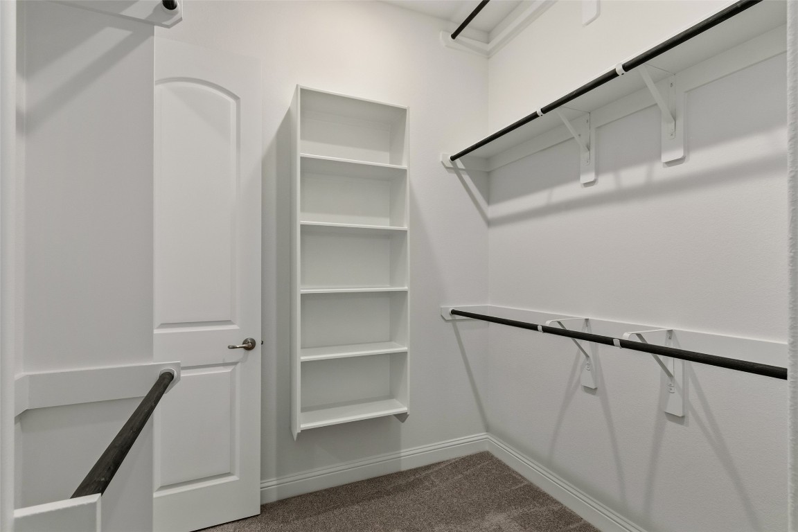 339 Afton June Drive Rosenberg, TX 77471 - Photo 30 of 44 a view of walk in closet with empty racks