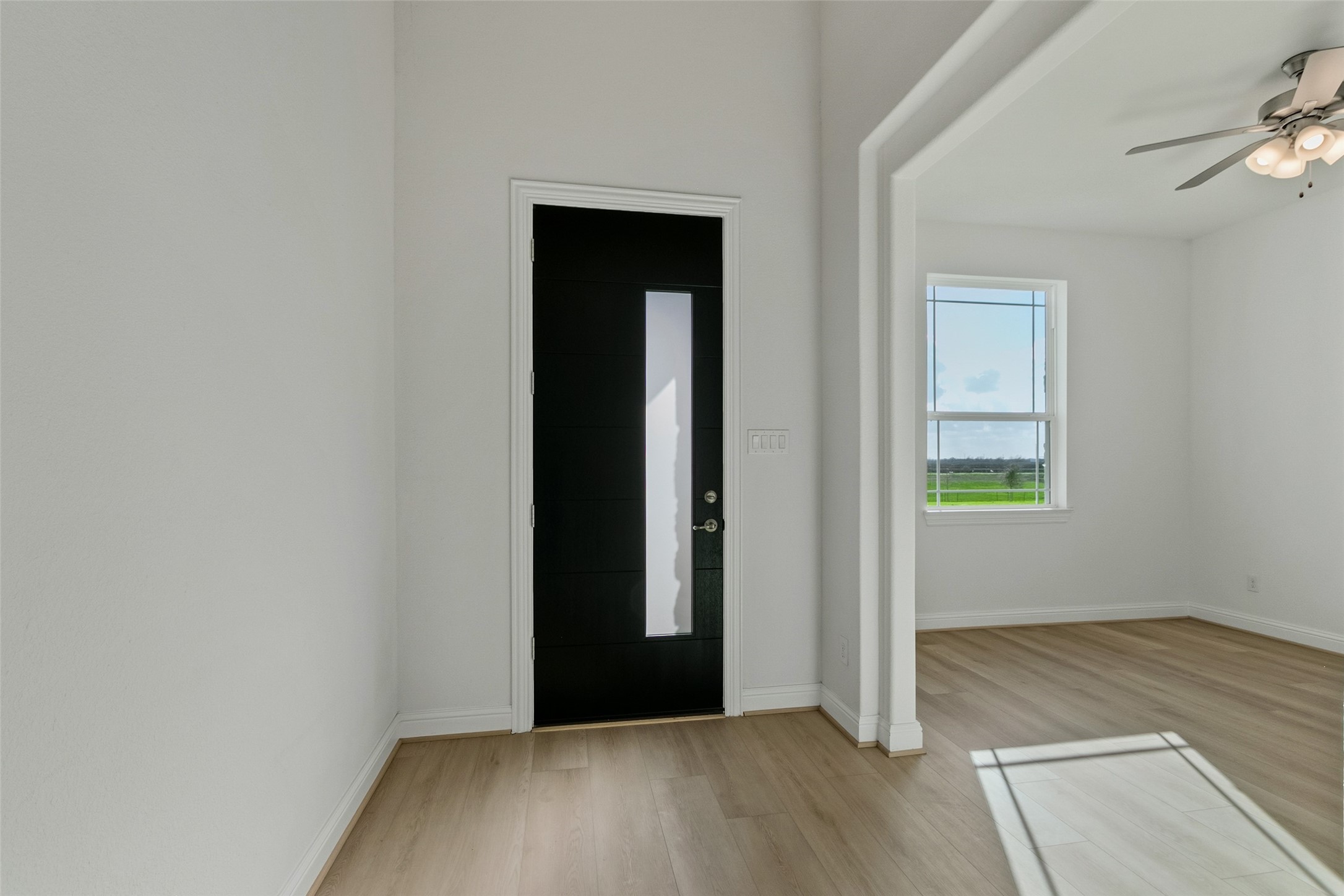 339 Afton June Drive Rosenberg, TX 77471 - Photo 7 of 44 an empty room with wooden floor and windows