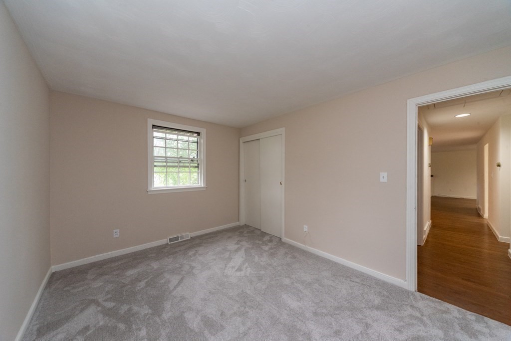 10 Fencourt Road Canton, MA 02021 - Photo 14 of 29 an empty room with windows and entrance